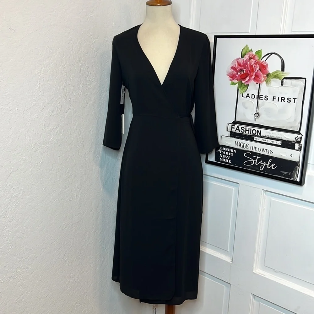 aritzia black wrap dress Aritzia Babaton slit wrap dress in black. (Swipe